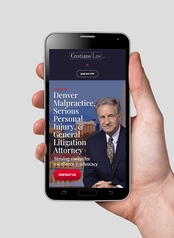 hand holding phone with Cristiano Law site pulled up